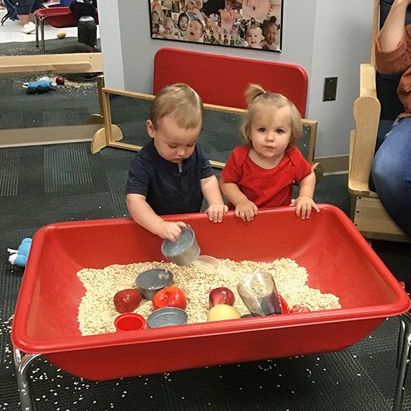 Children playing at sensory table